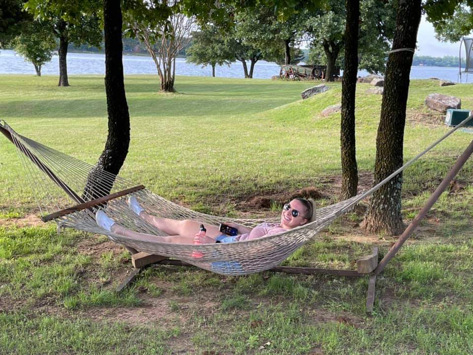 Female survivor relaxing in a hammock. 