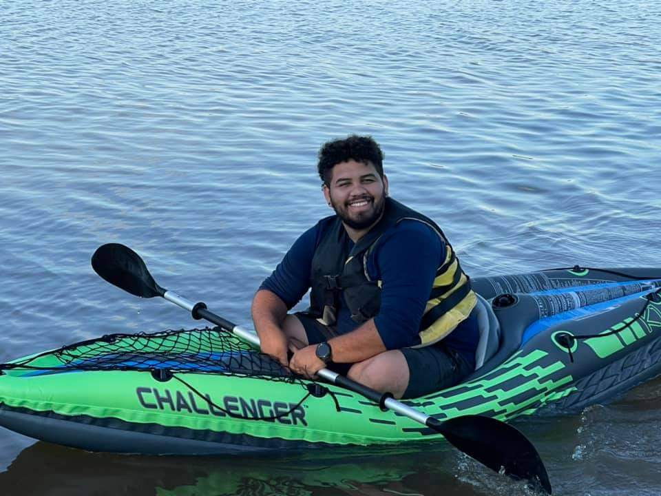 Male survivor enjoying the water in a kayak. 